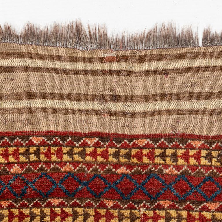 An antique Beshir carpet, ca 495 x 206 cm, around the year 1875.