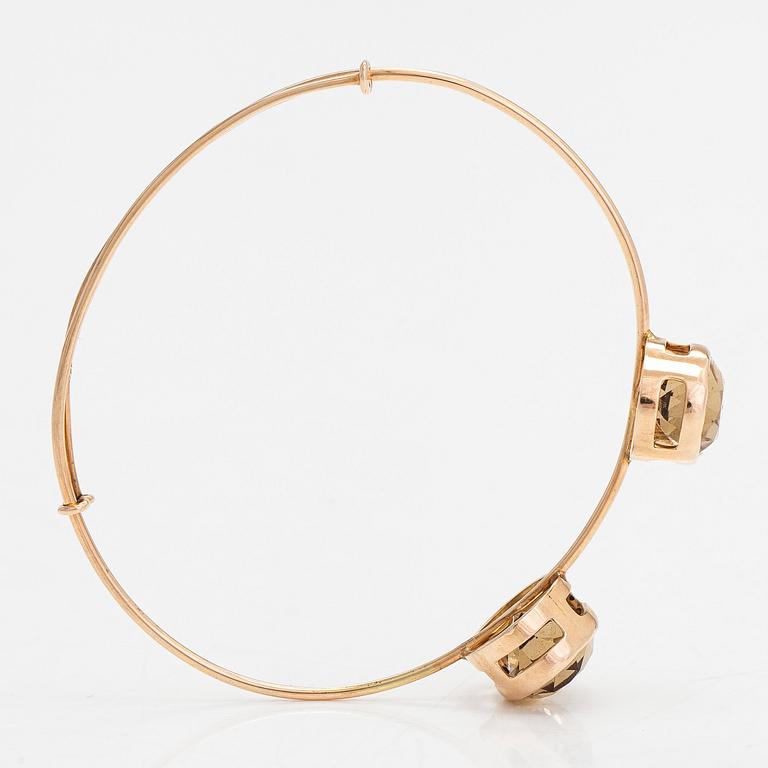 Armring, 14K guld och rökkvarts. Westerback, Helsingfors, 1957.