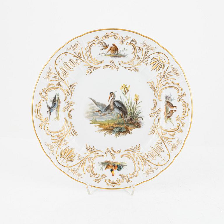 A set of five Meissen porcelain games plates, late 19th to early 20th century.
