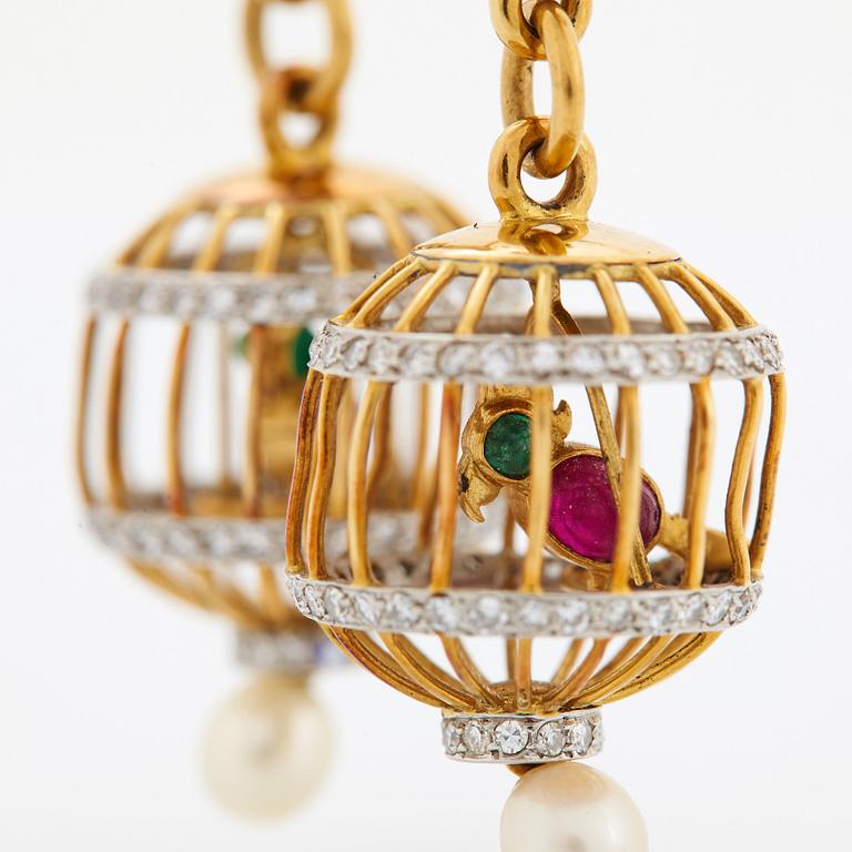 A pair of 18K gold birdcage earrings set with eight-cut diamonds, rubies and emeralds.