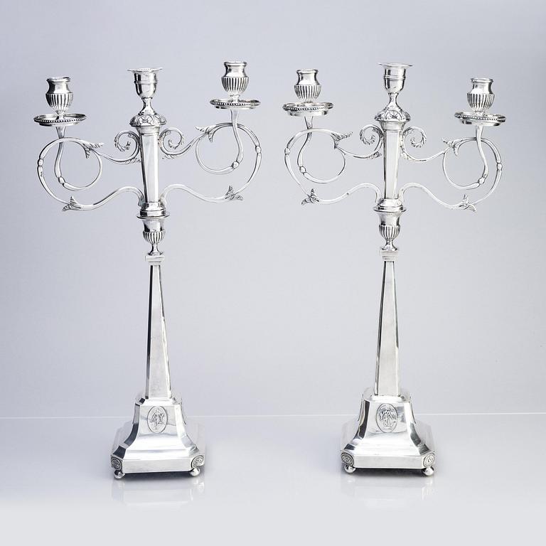 A pair of Swedish silver candelabras, marks of Pehr Zethelius, Stockholm 1797 and Daniel Hedberg, Eksjö 1829.