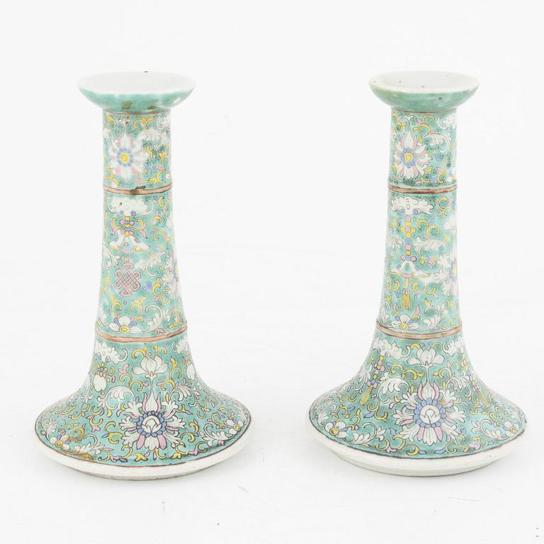 A pair of Chinese porcelain candle sticks, Qing dynasty, 19th century.