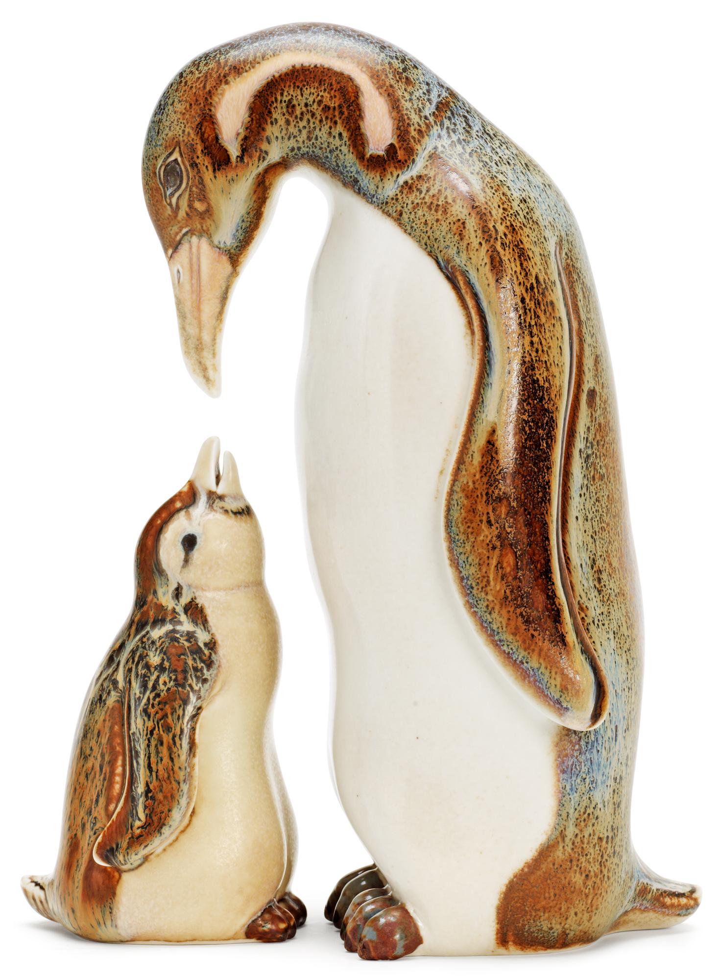 Two Gunnar Nylund stoneware figures depicting a penguin mother with child, Rörstrand.