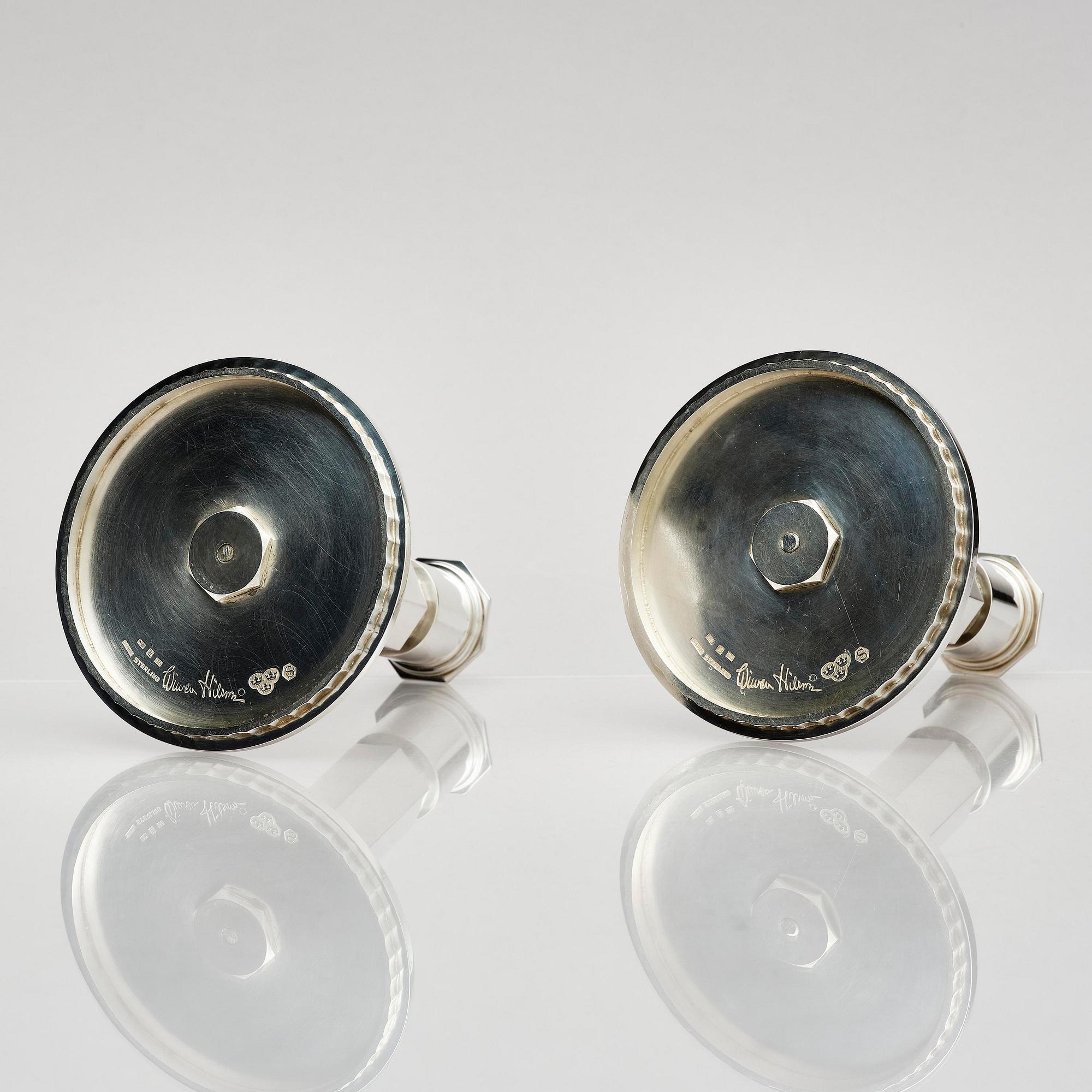 Wiwen Nilsson, a pair of sterling silver candlesticks, Lund, Sweden 11957 and 1960.