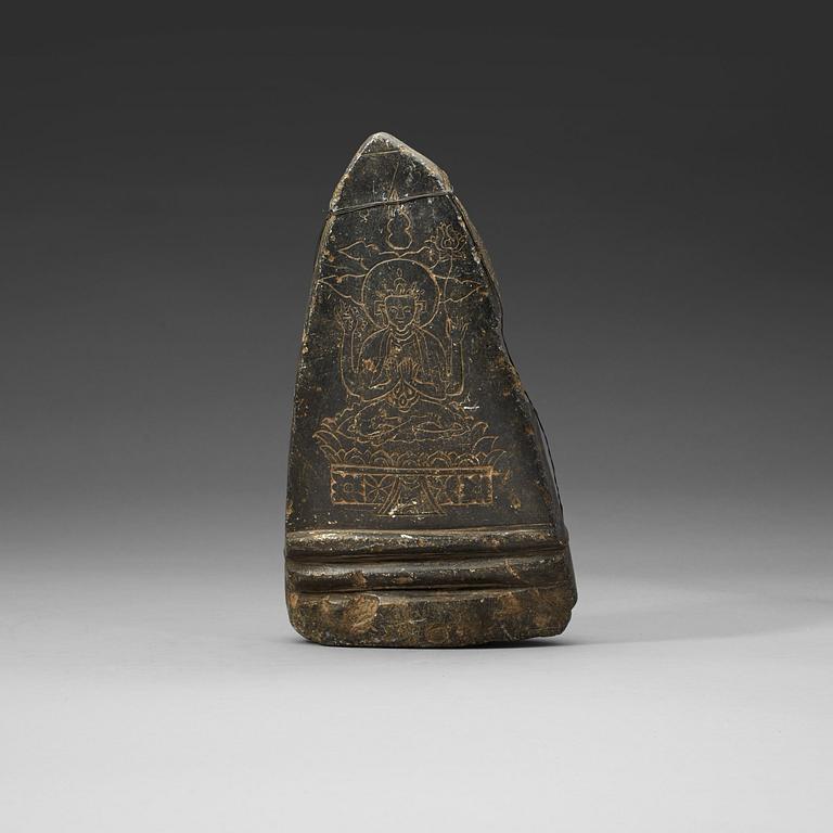 A carved Tibetan votive placque.