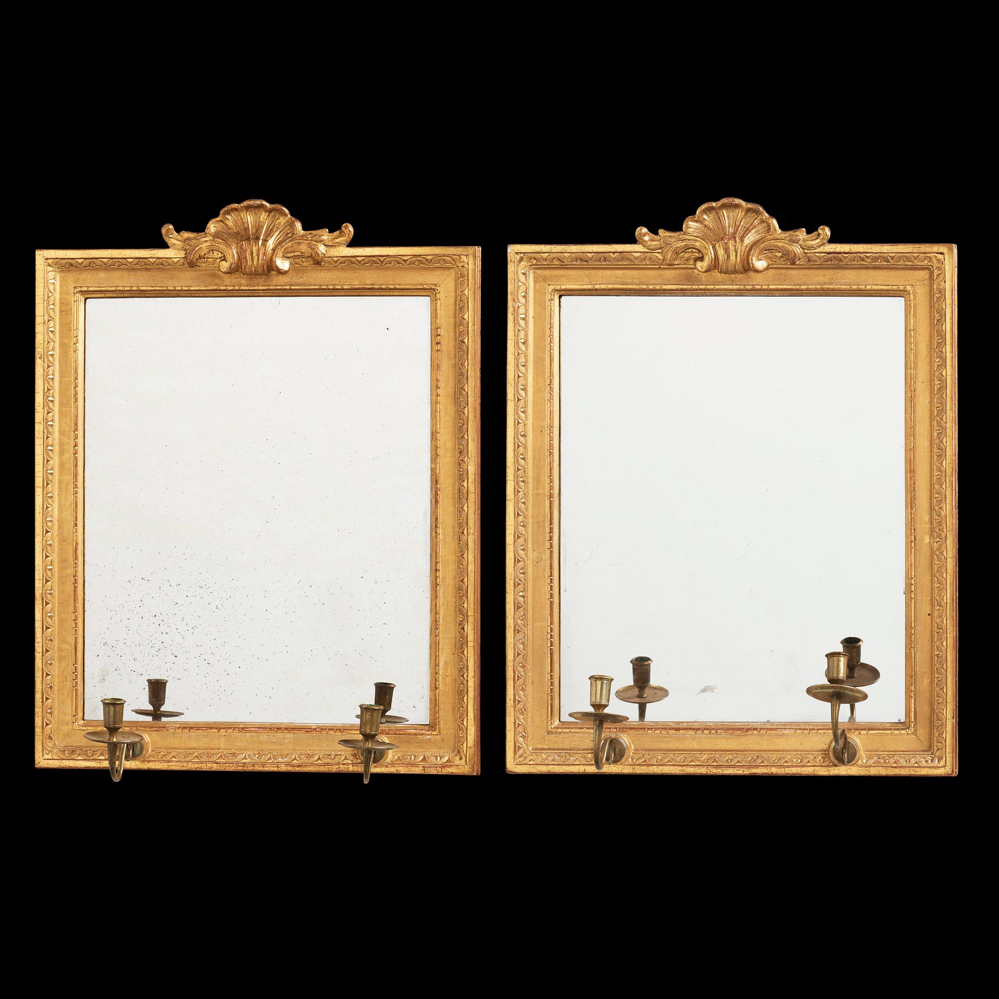 A pair of Gustavian two-light girandole mirros, one dated 1784.