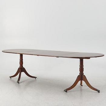 A dining table, 20th century, England.