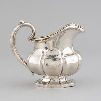 A Russian 19th century parcel-gilt silver cream-jug, mark of Abraham Forstedt, St. Petersburg 1840.