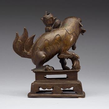 A bronze figurine of a mythological animal, presumably Ming dynasty (1368-1643).