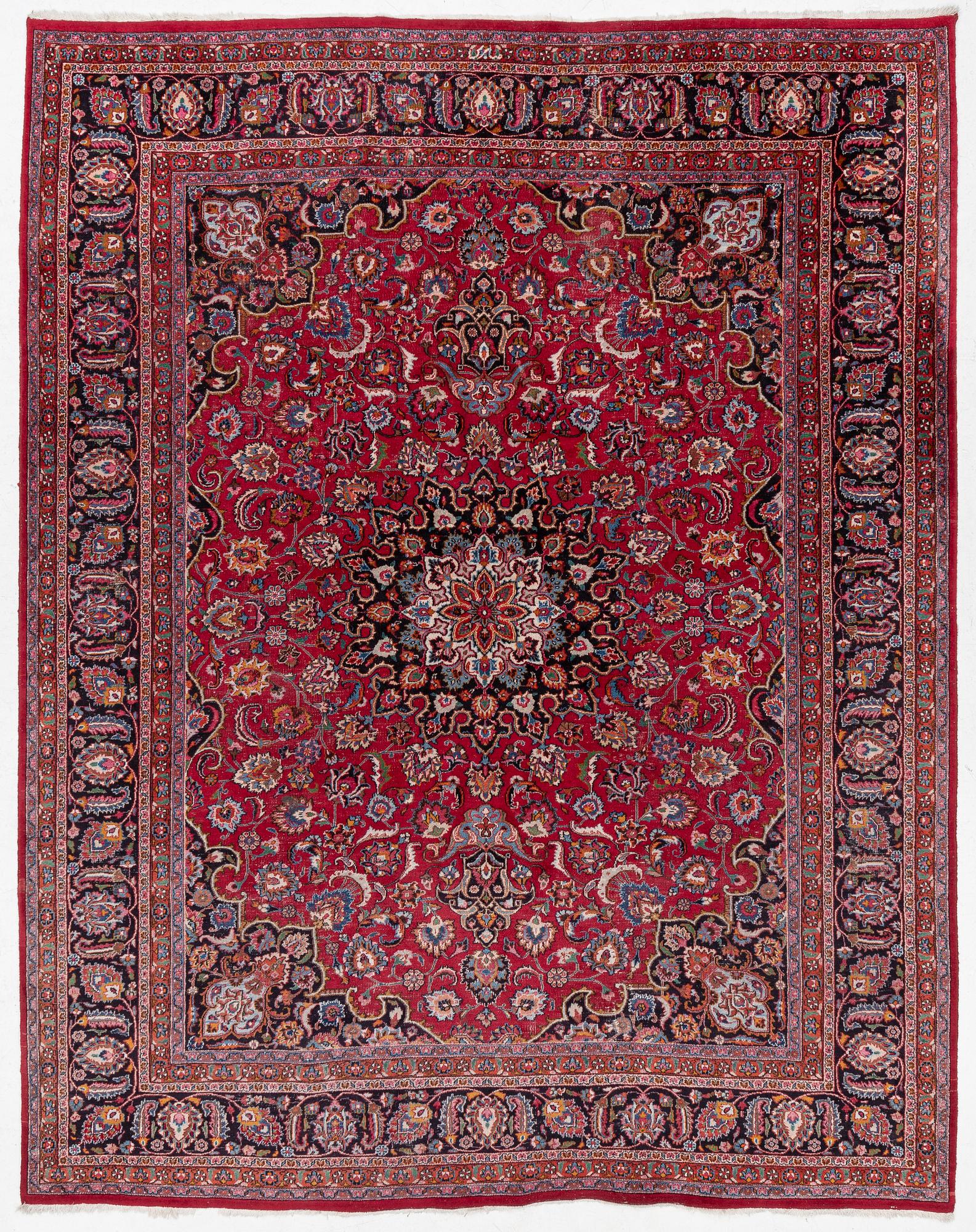 An Oriental carpet, approx. 380 x 304 cm.