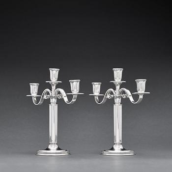 W.A Bolin, a pair of two branched silver candelabra, Stockholm 1935.