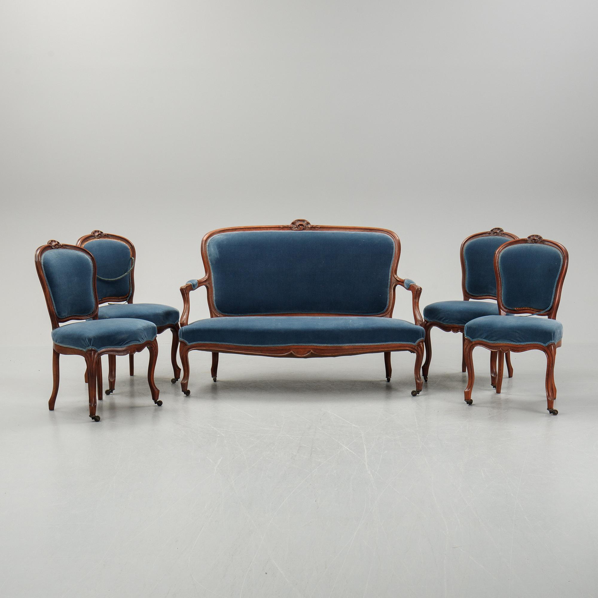 A sofa and a set of four chairs, Rococo revival, late 19th century.
