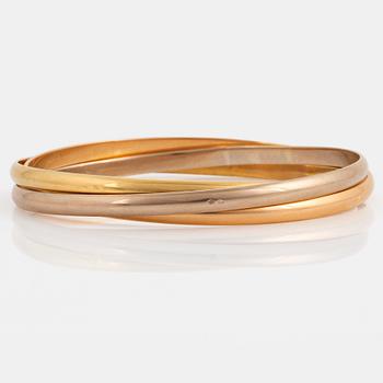 A Cartier "Trinity" bangle.