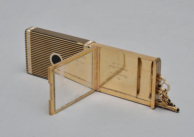 CARTIER MAKE-UP BOX, 18K gold, enamel, onyx. New York 1940 s. Weight 152 g.