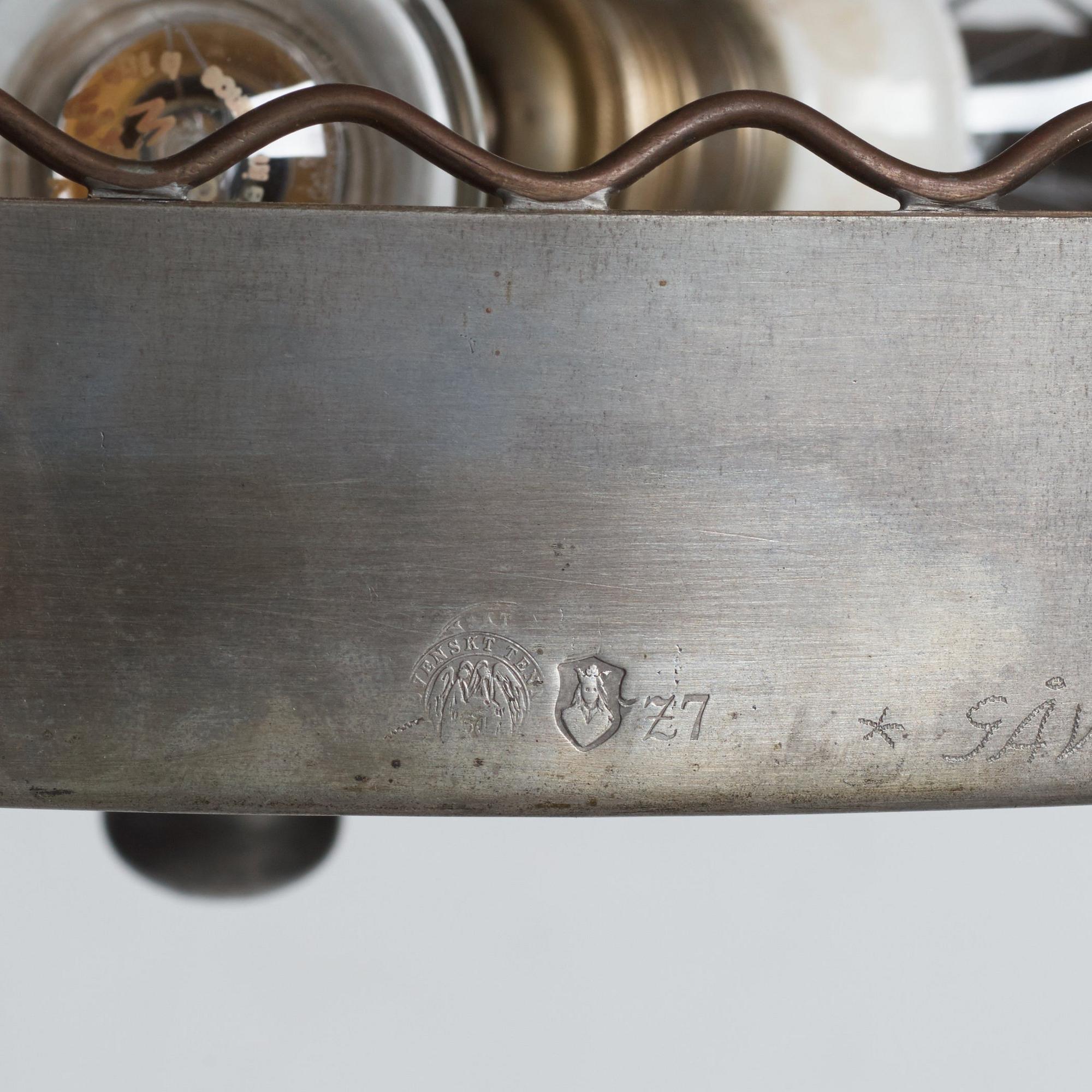 Firma Svenskt Tenn, a pewter and brass chandelier, Stockholm 1926.