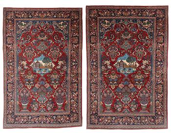 A pair of semi-antique pictoral Kashan rugs, ca 200 x 130 and 197 x 128 cm.