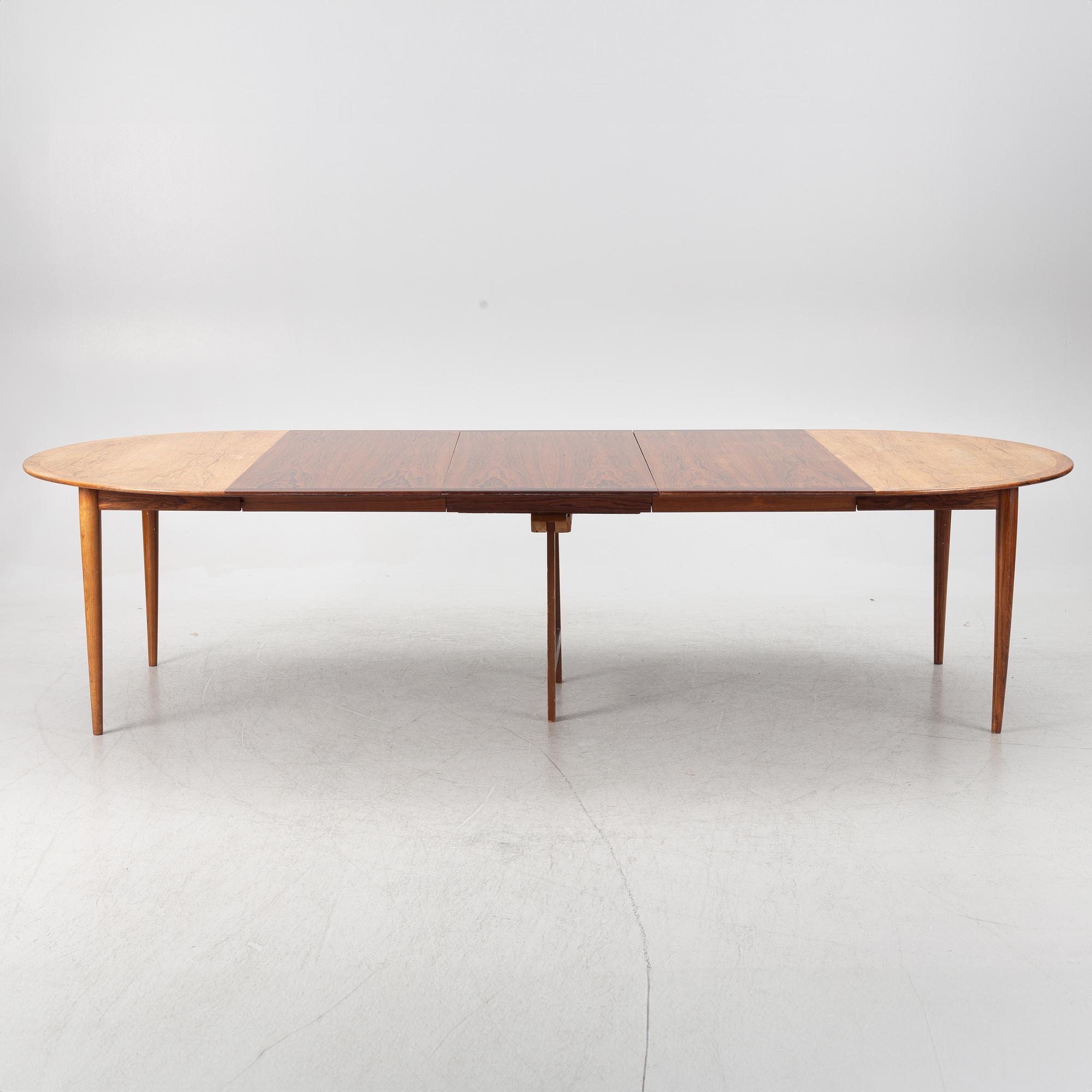 Niels Otto Møller, a rosewood dining table and eight rosewood chairs, Poul Jeppesen & JL Möller, Denmark, 1960's.