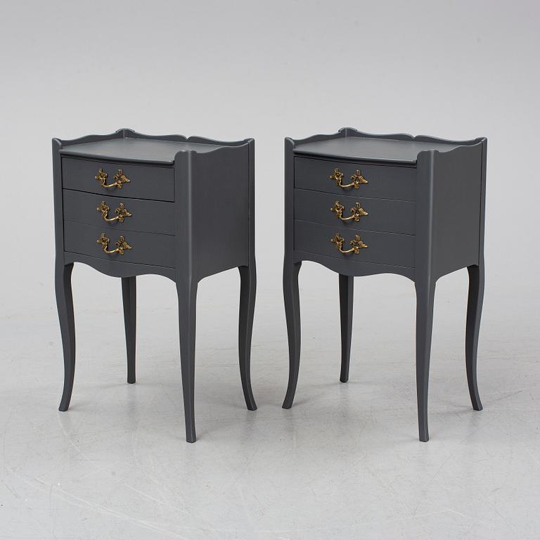 A pair of rococo style bedside tables.