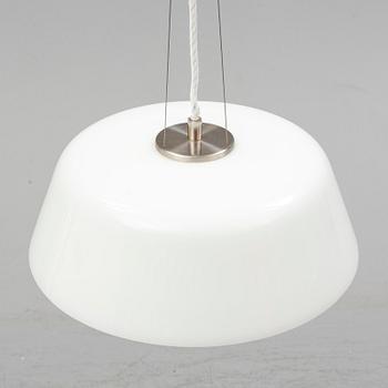 An Arne Jacobsen "Centenary Package" comprising three "Ant Chairs" and an eggshaped table, Fritz Hansen, Denmark.