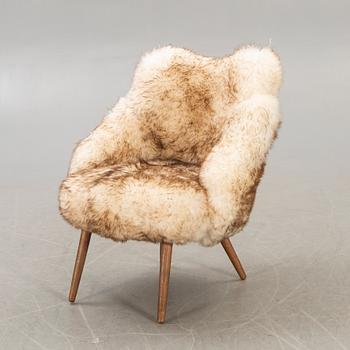 A 1950/60 sheepskin armchair.