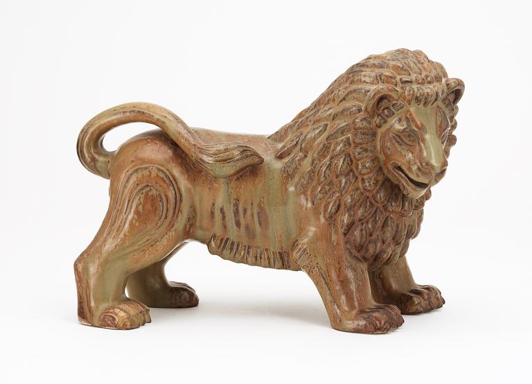 A Gunnar Nylund stoneware figure of a lion, Rörstrand.