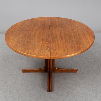 A walnut vereered dining table, mid 20th Century.
