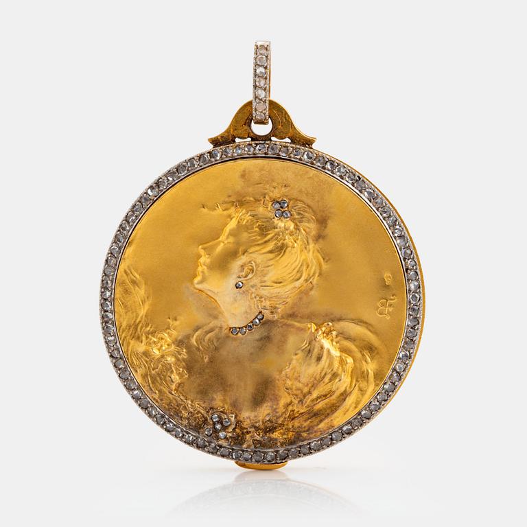 An Epinay de Briort pendant/locket in 18K gold and platinum set with an old-cut diamond ca 0.50 ct.