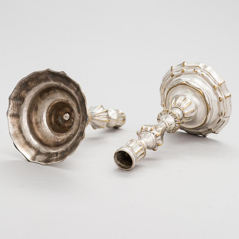 A pair of mid 18th century brass, argent haché, candlesticks, France.