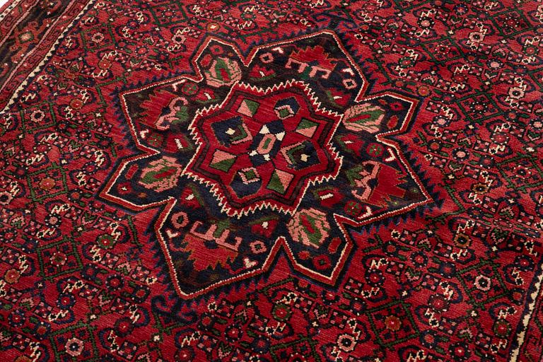 A Hosseinabad rug, c. 222 x 157 cm.