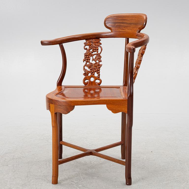 A Chinese hardwood corner armchair, 1900s.