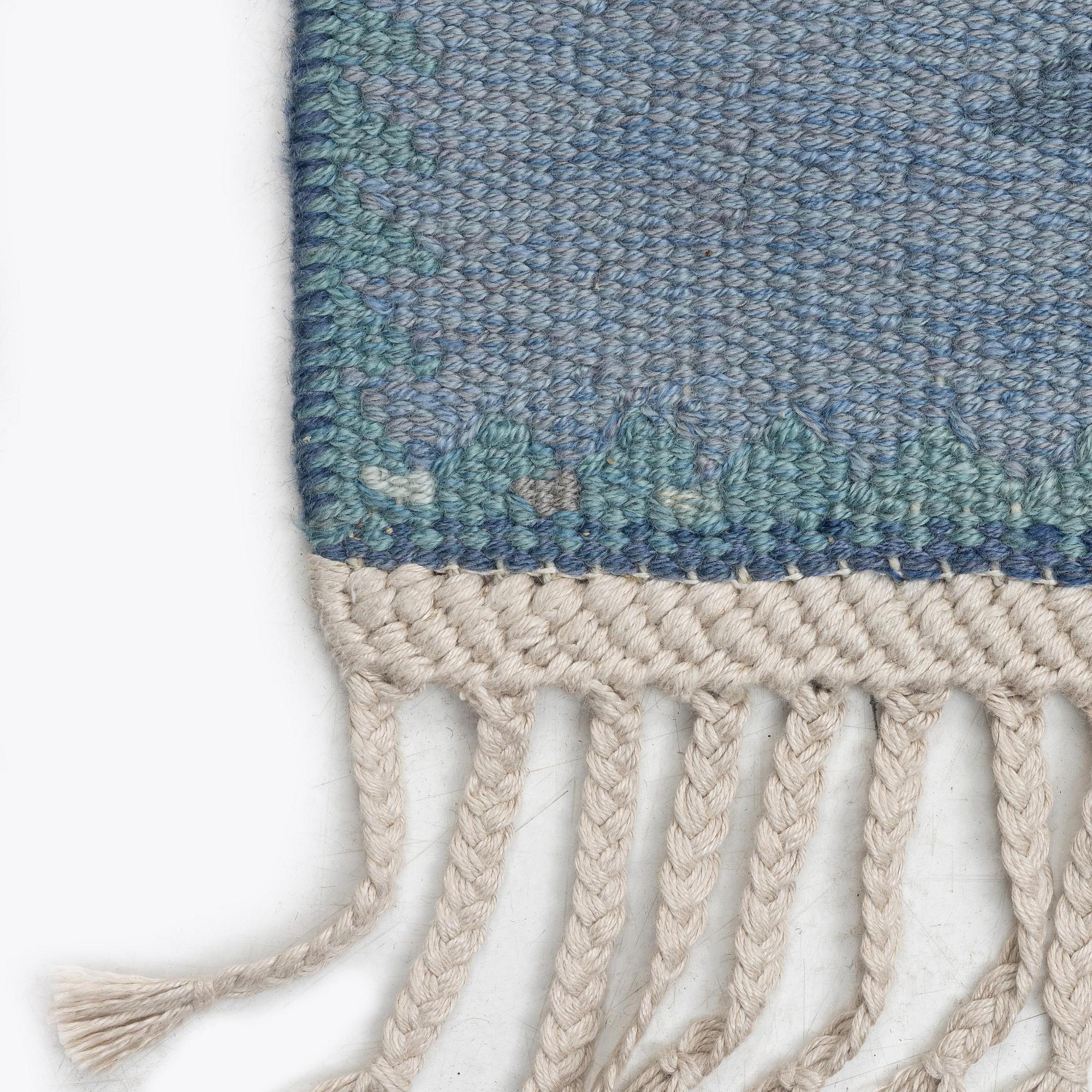 Barbro Nilsson, a carpet, 'Tånga mellanblå', flat weave, c. 350 x 252 cm, signed AB MMF BN.