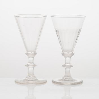 A set of 19 similar drinking glasses from the turn of the 19th/20th century.