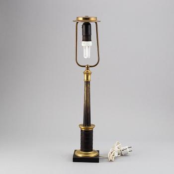 An empire style table lamp from the first half of the 20th century.
