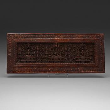 199. A large carved wooden sutra-board, Tibet, presumably 15th century.