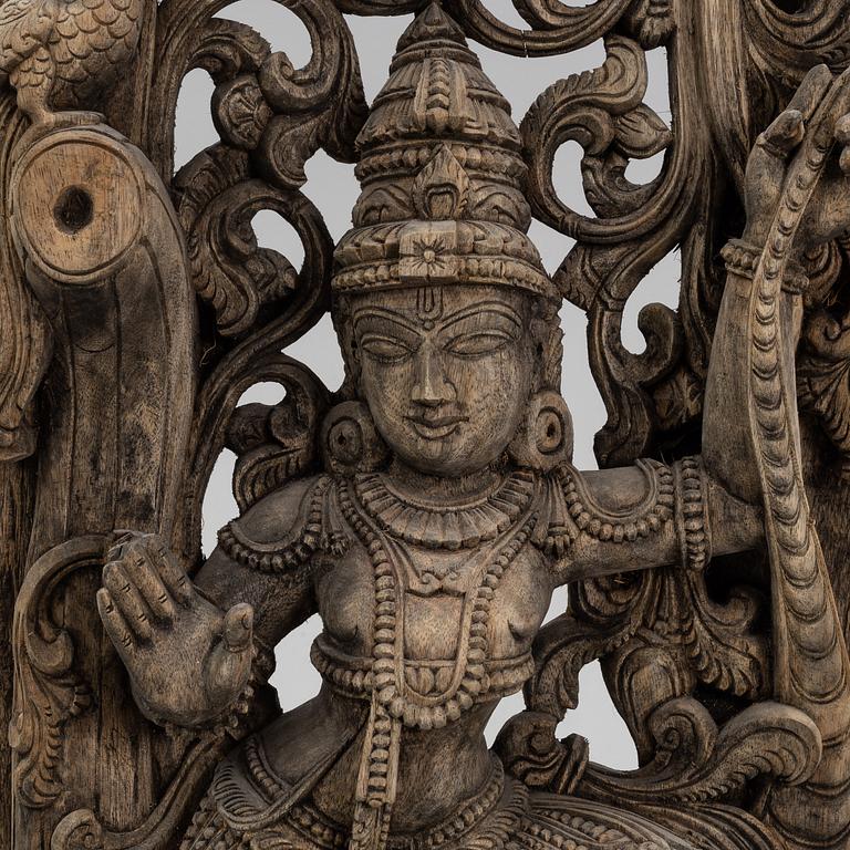 A carved wooden Shiva, India, around the year 1900.