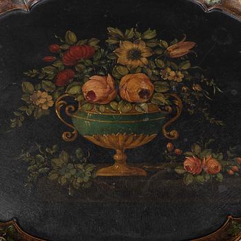 A rococo style side table with a loose tray.