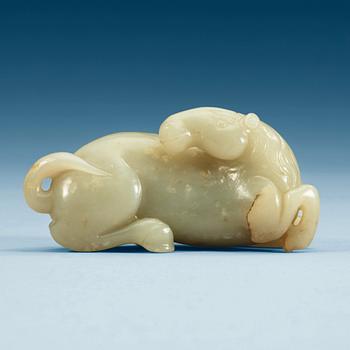 1405. A carved nephrite figure of a reclining horse.