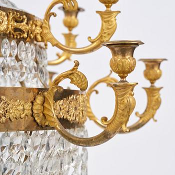 An ormolu and cut glass sixteen-branch Empire chandelier, Paris, early 19th century.
