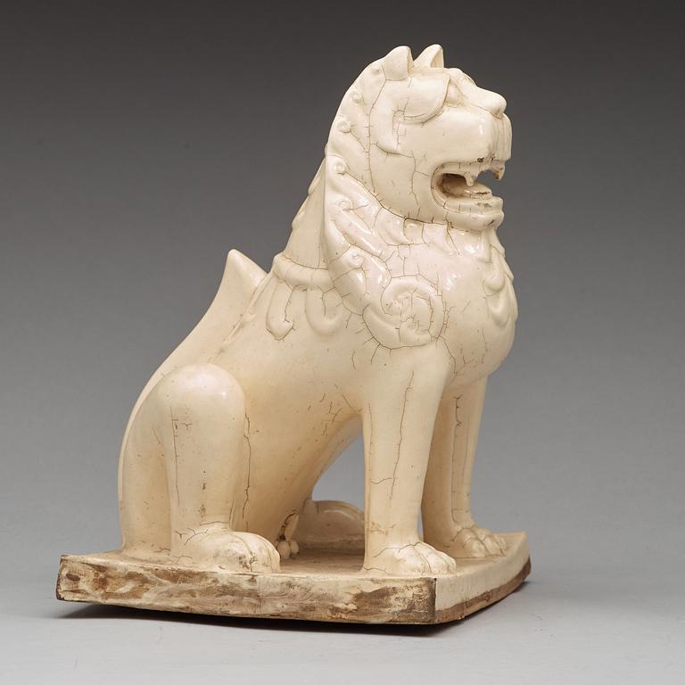 A white glazed seated mythical beast, Qing dynasty, presumably Kangxi (1662-1722).