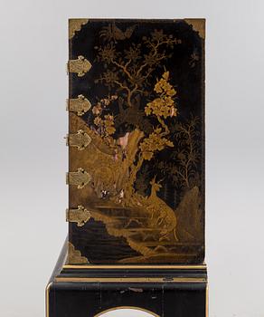 AN early 18TH CENTURY PROBABLY ENGLISH Japanned laquer cabinet on stand.
