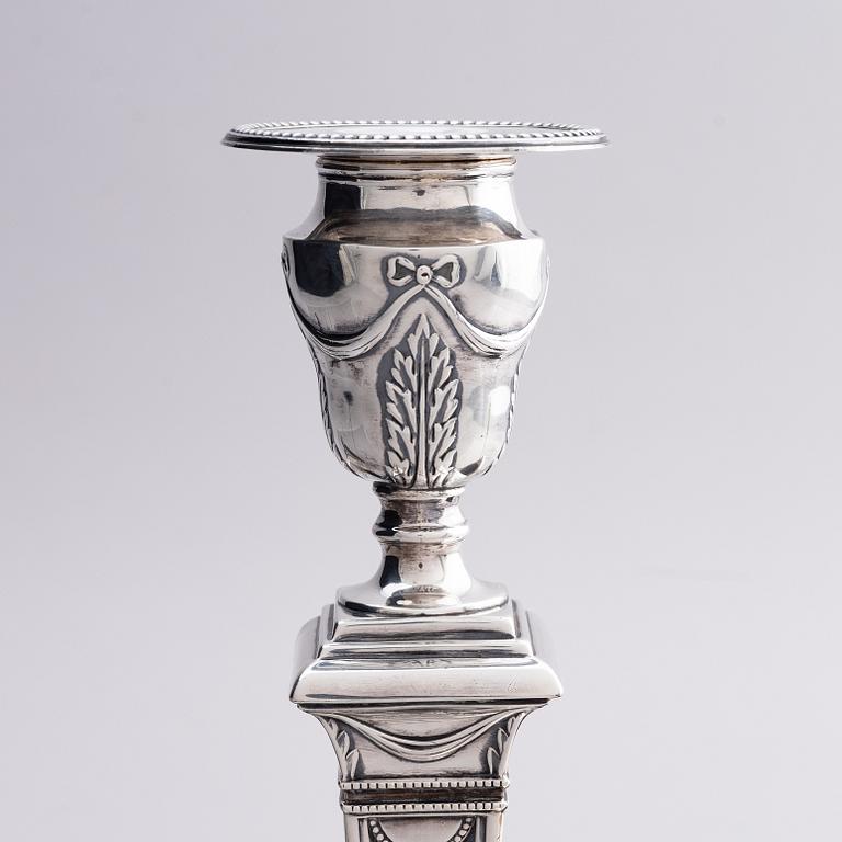 Four early 20th century silver candlesticks, marks of Hawksworth, Eyre & Co Ltd, Sheffield, England 1904-1906.