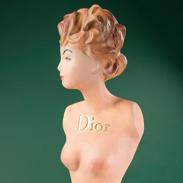 a Christian Dior mannequin doll, probably from the 1950s.