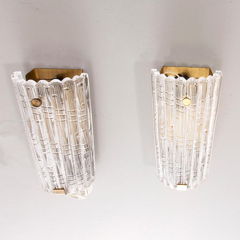 A pair of Carl Fagerlund wall scones from Orrefors later part of the 20th century.