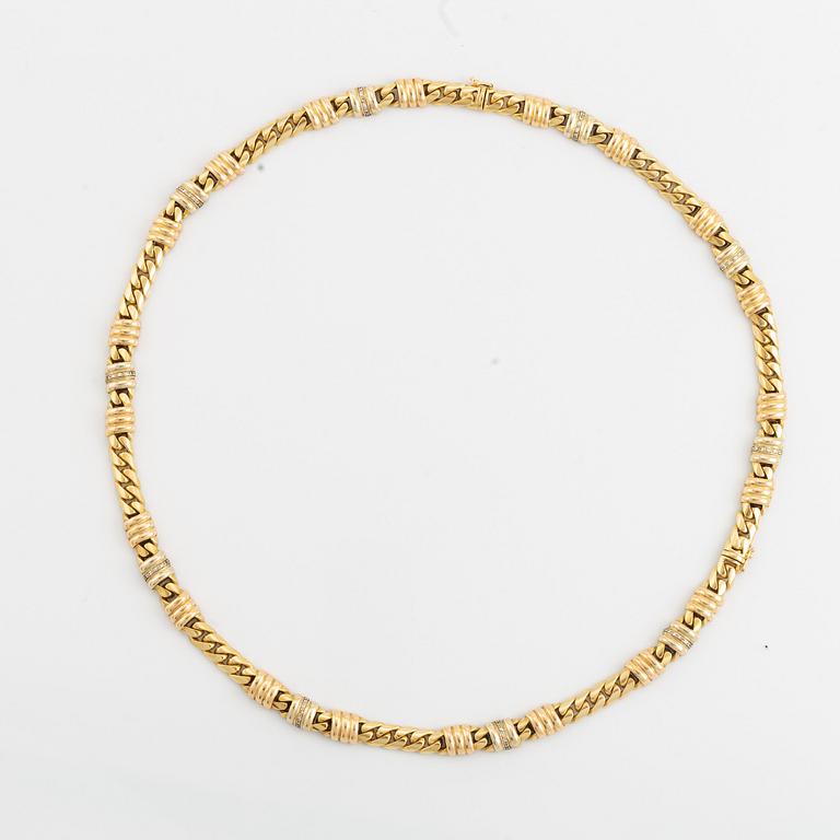 An 18K gold necklace/bracelet combination set with brilliant-cut diamonds.