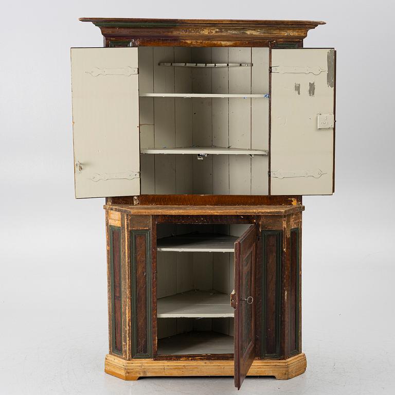 A corner cupboard, dated 1779.