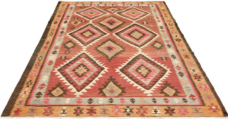 A Persian Nomad Kilim carpet, c 270 x 173 cm.