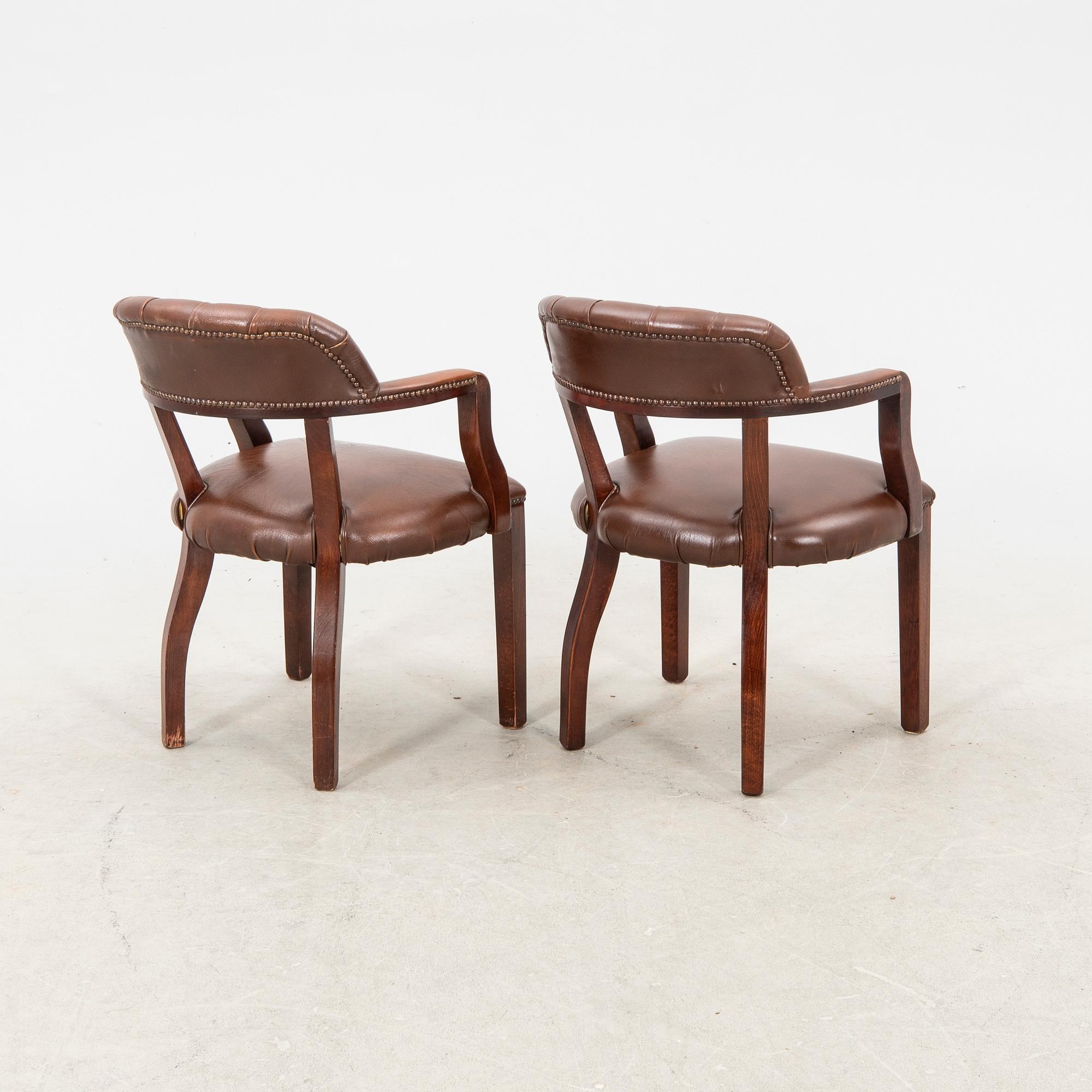 A pair of leather armchairs from the second half of the 20th century.
