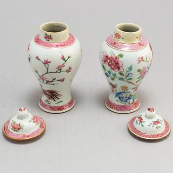 A set of three famille rose plates and two minature vases with covers, Qing dynasyt, Qianlong (1736-95).