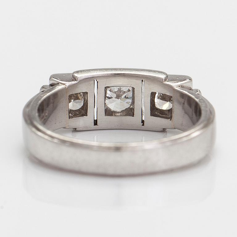 A.Tillander, a platinum three-stone ring, with brilliant-cut diamonds totalling approximately 1.18 ct.