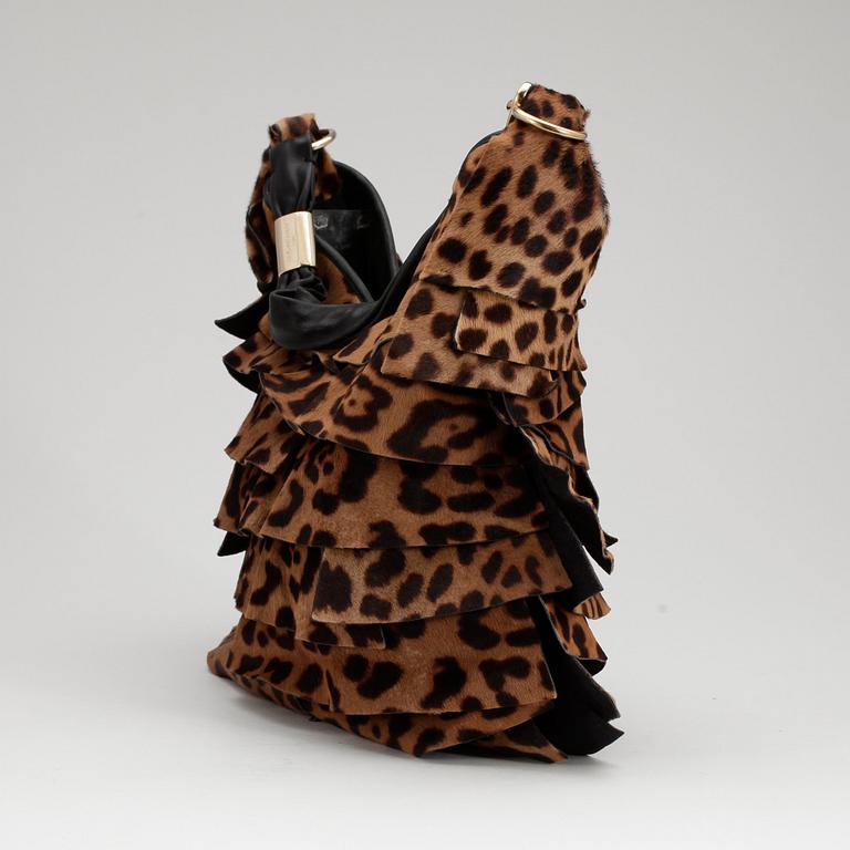 YVES SAINT LAURENT, a leopard and black leather shoulder bag.